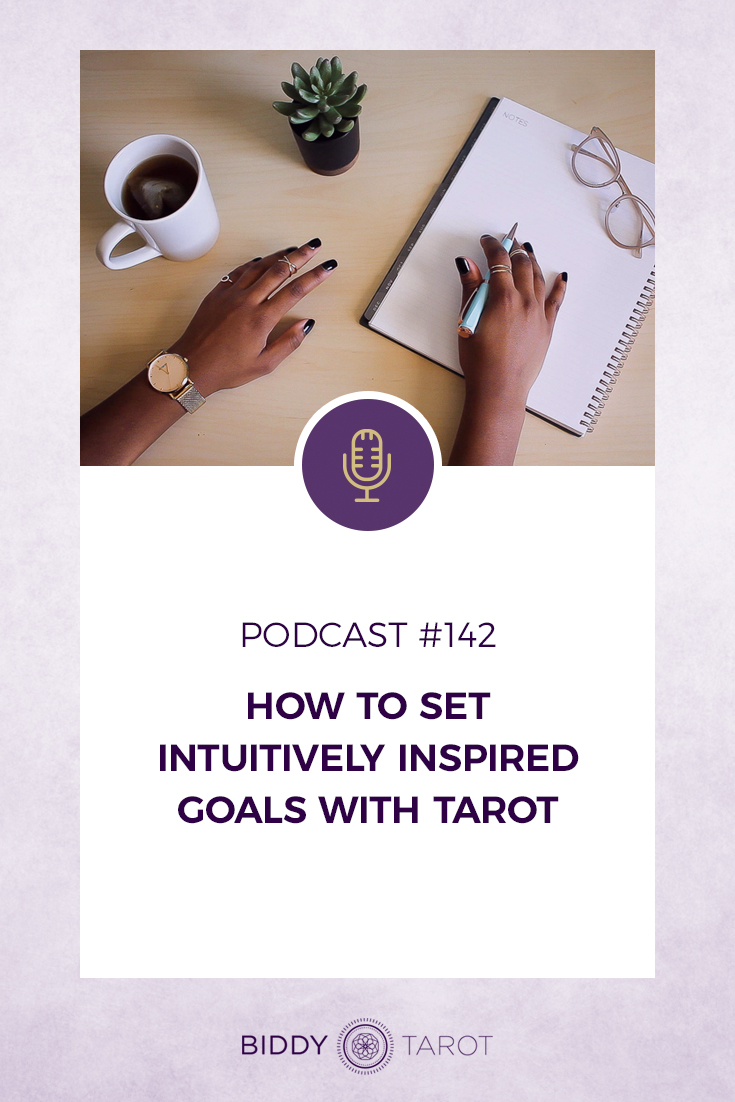 How to Set Intuitively Inspired Goals with Tarot | Woman writing in a notebook with a cup of tea and a succulent on the desk| Biddy Tarot